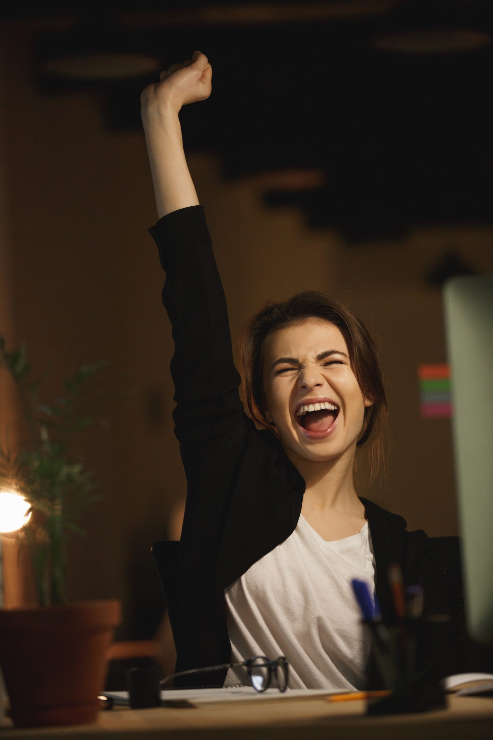 yawning young lady designer sitting office night scaled